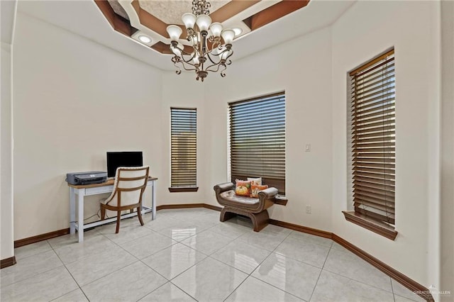 tiled home office featuring an inviting chandelier and plenty of natural light