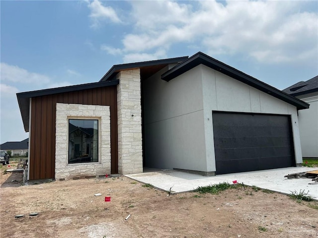 2218 N Piedra Ave, Edinburg, TX 78542 - view of front facade with stone siding and a garage