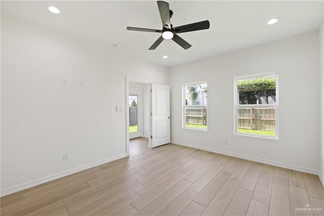 2312 Corales St, Mission, TX 78573 - spare room with baseboards, light wood-style flooring, recessed lighting, and ceiling fan