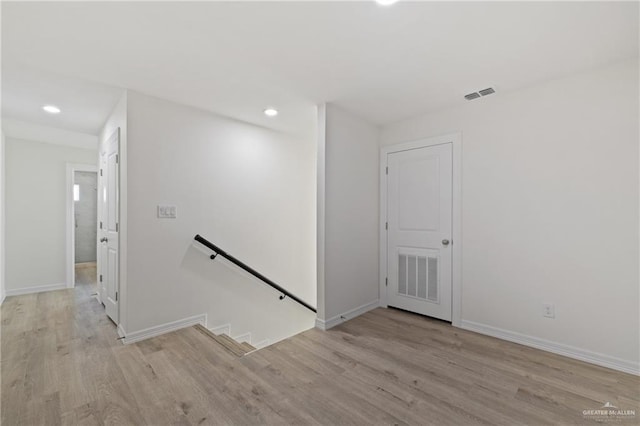 2312 Corales St, Mission, TX 78573 - empty room with wood finished floors, recessed lighting, and baseboards