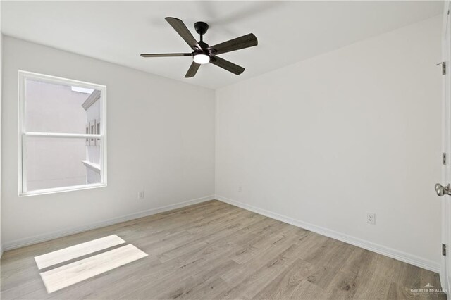2312 Corales St, Mission, TX 78573 - spare room with light wood finished floors, ceiling fan, and baseboards