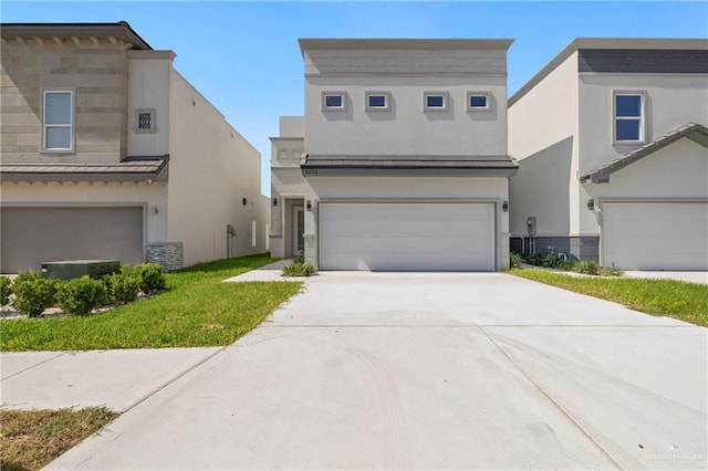 2312 Corales St, Mission, TX 78573 - view of front facade with stucco siding, concrete driveway, and a garage