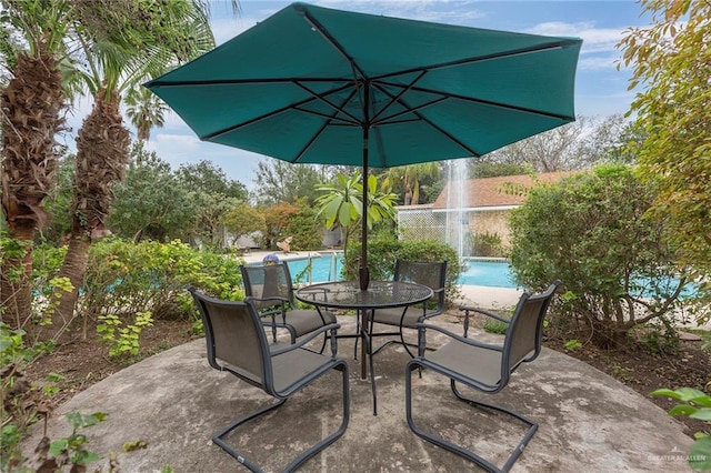 view of patio featuring pool water feature