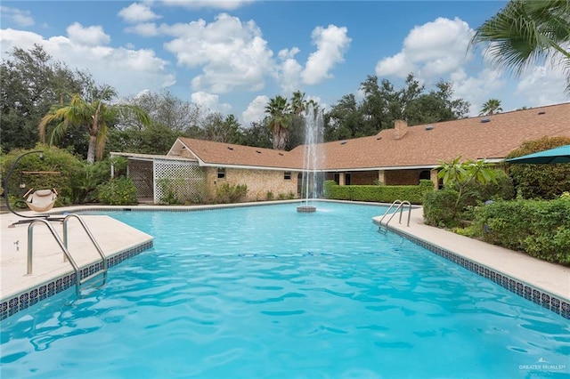 view of pool with pool water feature