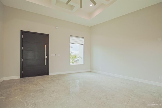 empty room with baseboards, coffered ceiling, marble finish floor, a high ceiling, and recessed lighting