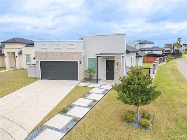 modern home with stucco siding, concrete driveway, fence, a garage, and a front lawn