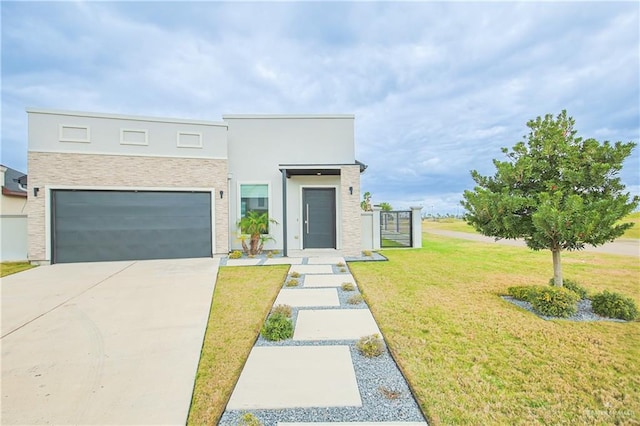 contemporary house with a garage, a front lawn, concrete driveway, and stucco siding