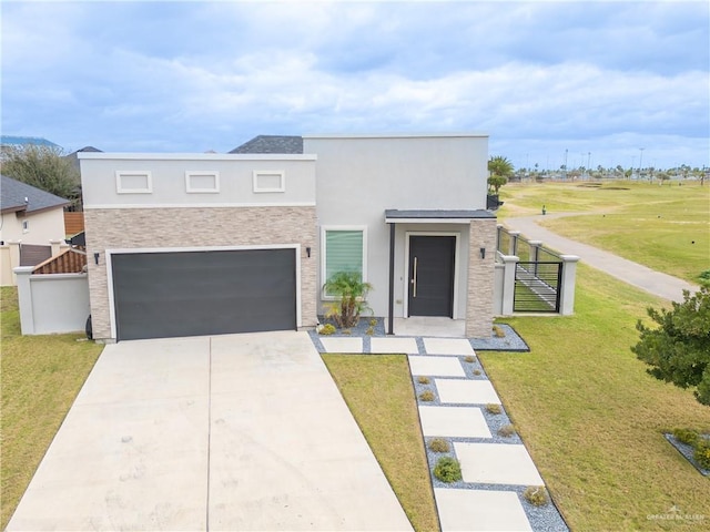 view of front facade with a garage, fence, concrete driveway, stucco siding, and a front yard