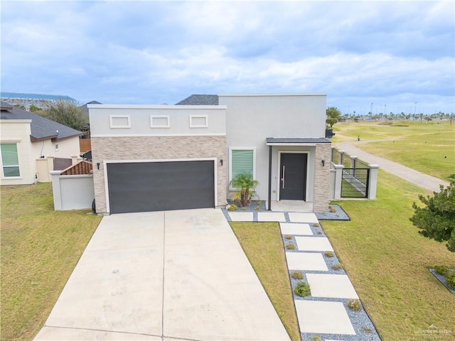 contemporary house featuring driveway, a front yard, fence, and stucco siding