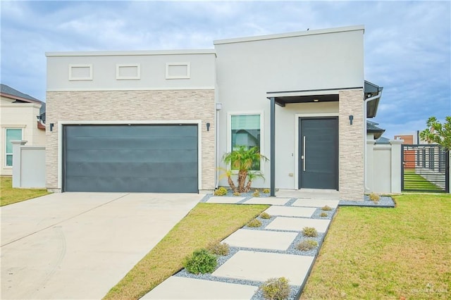 view of front of house featuring driveway, a garage, fence, a front lawn, and stucco siding