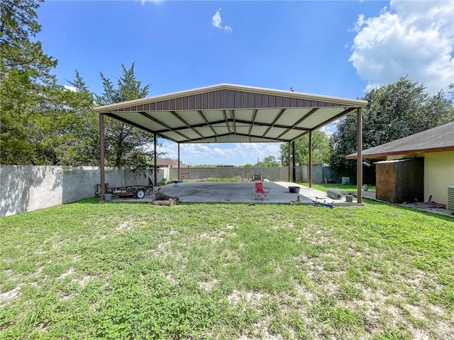 view of parking / parking lot featuring a yard