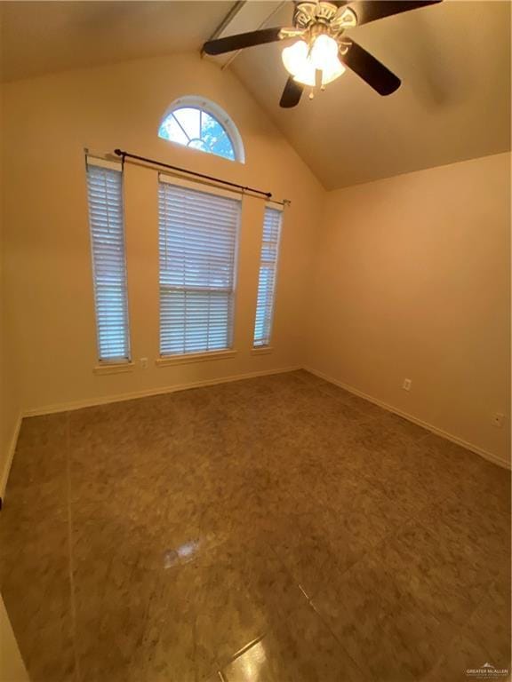 804 Ray St, Donna, TX 78537 - spare room with lofted ceiling with beams, a ceiling fan, and baseboards