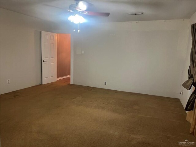 spare room with carpet and ceiling fan