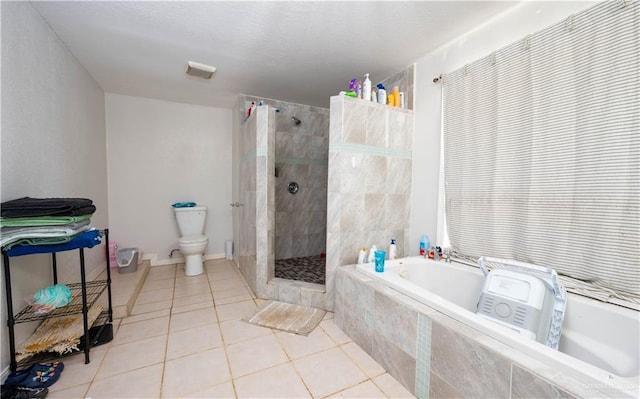 275 Violeta St, San Benito, TX 78586 - bathroom featuring a garden tub, a tile shower, toilet, and tile patterned floors