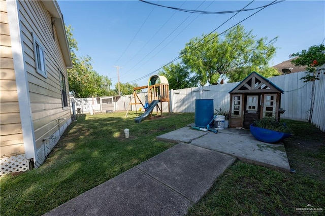 275 Violeta St, San Benito, TX 78586 - view of yard featuring a playground and an outbuilding
