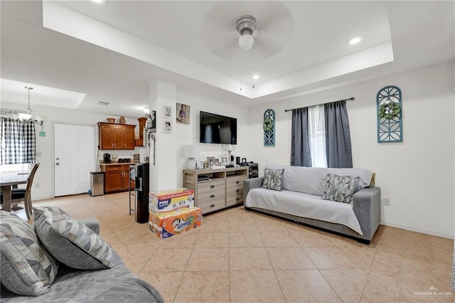 115 W Albatross Ave, Pharr, TX 78577 - living area with a raised ceiling, ceiling fan with notable chandelier, recessed lighting, baseboards, and light tile patterned floors
