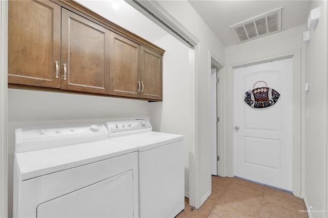 115 W Albatross Ave, Pharr, TX 78577 - washroom with cabinet space, baseboards, light tile patterned floors, visible vents, and washing machine and dryer