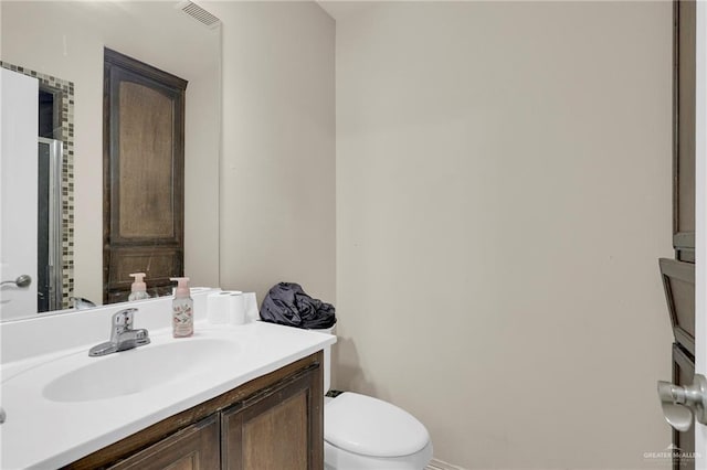 115 W Albatross Ave, Pharr, TX 78577 - bathroom featuring toilet, visible vents, and vanity