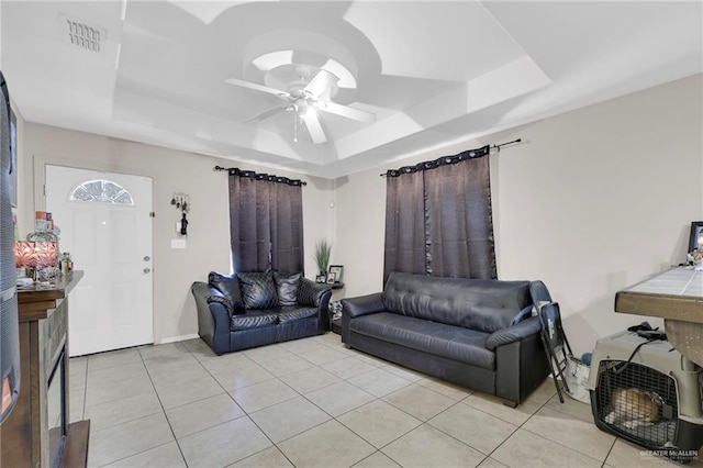 115 W Albatross Ave, Pharr, TX 78577 - living room featuring ceiling fan, visible vents, light tile patterned floors, a raised ceiling, and baseboards