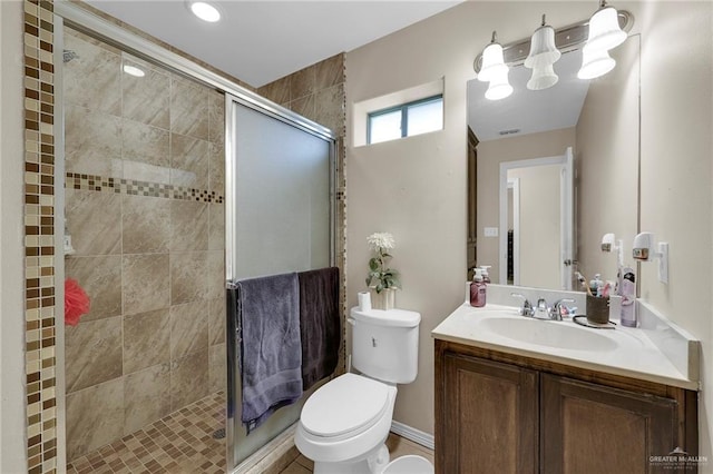 115 W Albatross Ave, Pharr, TX 78577 - bathroom featuring toilet, a shower stall, and vanity
