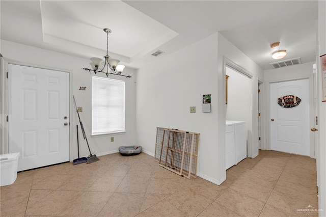 115 W Albatross Ave, Pharr, TX 78577 - entrance foyer with light tile patterned floors, a notable chandelier, independent washer and dryer, and visible vents