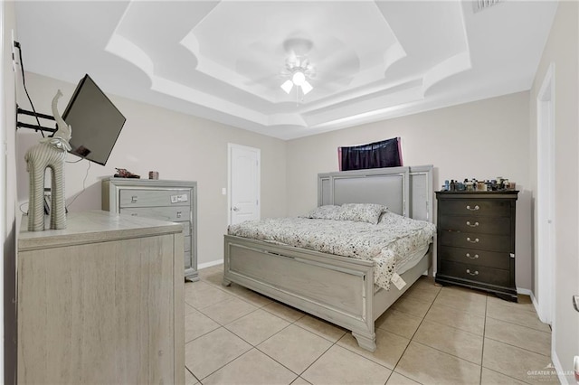 115 W Albatross Ave, Pharr, TX 78577 - bedroom featuring baseboards, ceiling fan, light tile patterned floors, and a raised ceiling