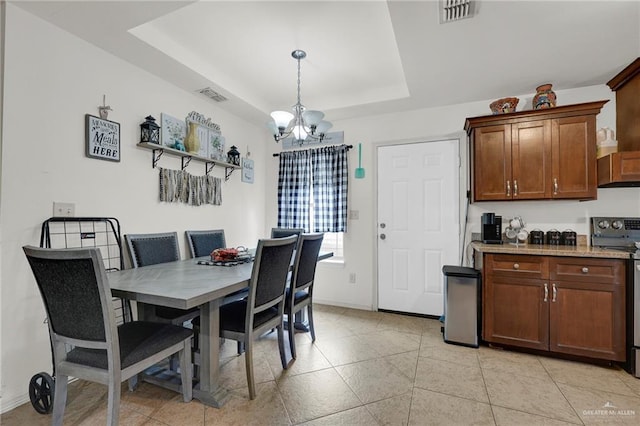 115 W Albatross Ave, Pharr, TX 78577 - dining area with baseboards, a raised ceiling, a chandelier, and visible vents