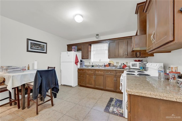 115 W Albatross Ave, Pharr, TX 78577 - kitchen featuring brown cabinetry, a sink, light stone counters, white appliances, and light tile patterned flooring