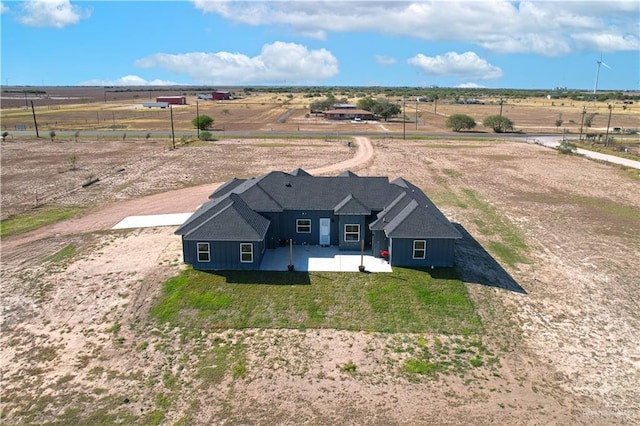 birds eye view of property with a rural view