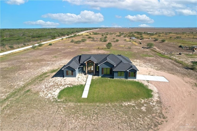 view of front of house with a rural view