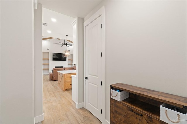 hallway with light hardwood / wood-style flooring