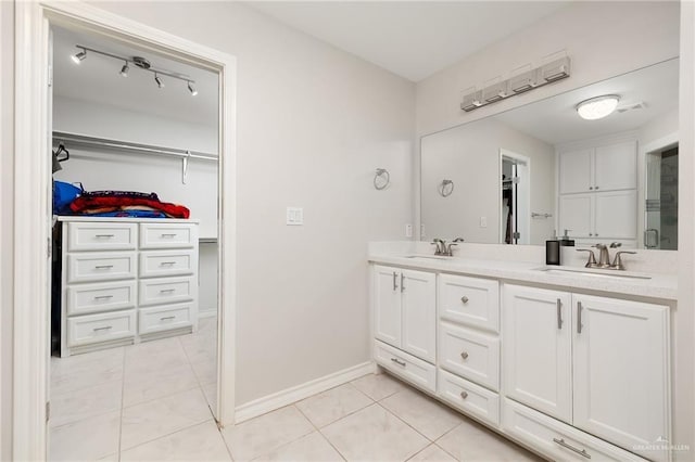 bathroom featuring tile patterned floors and vanity