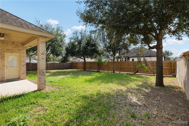 view of yard featuring ceiling fan