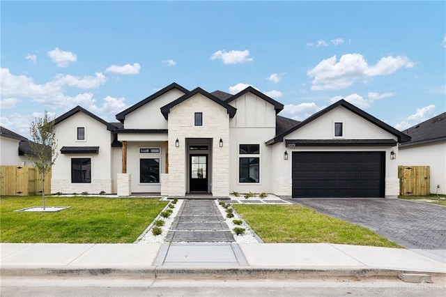 1003 Bette St, Pharr, TX 78577 - modern farmhouse featuring stone siding, a garage, decorative driveway, and stucco siding
