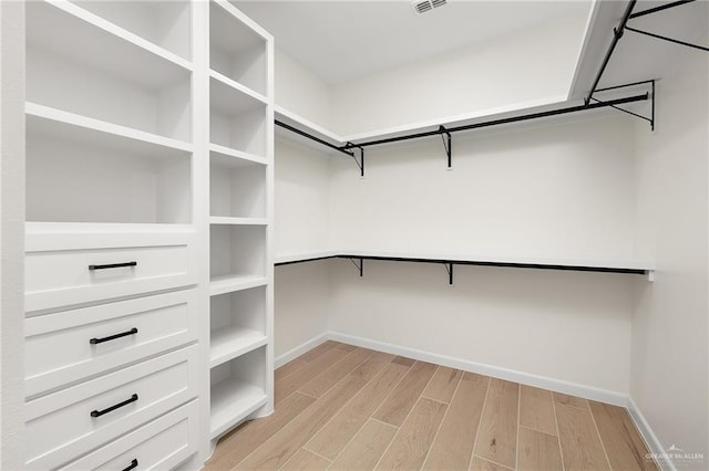 1003 Bette St, Pharr, TX 78577 - spacious closet with light wood-type flooring