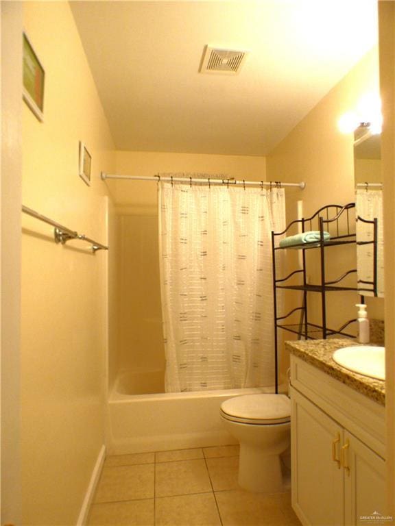 full bath featuring visible vents, vanity, tile patterned flooring, shower / bath combo with shower curtain, and toilet