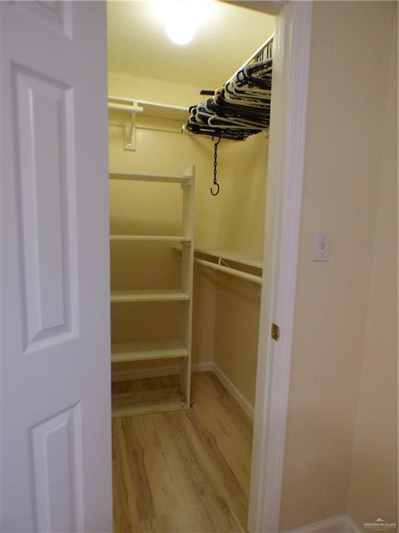 spacious closet with light wood-style flooring
