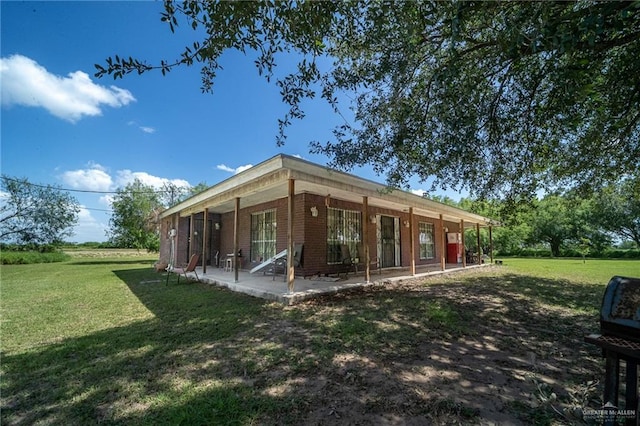 1806 N Doolittle Rd, Edinburg, TX 78542 - back of property featuring a yard and brick siding