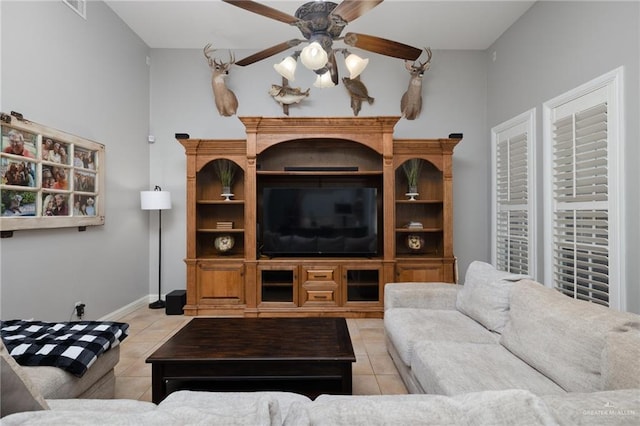 2513 Kings Dr, Edinburg, TX 78539 - living room with light tile patterned floors, a ceiling fan, and baseboards