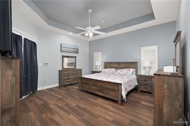 2513 Kings Dr, Edinburg, TX 78539 - bedroom featuring a raised ceiling, dark wood-style flooring, baseboards, recessed lighting, and ceiling fan