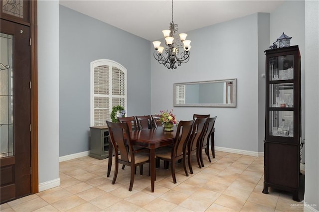 2513 Kings Dr, Edinburg, TX 78539 - dining room featuring a chandelier, baseboards, and light tile patterned flooring