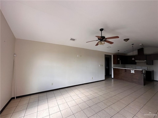 unfurnished living room featuring light tile patterned floors, vaulted ceiling, and ceiling fan