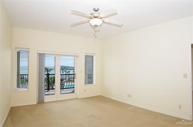 301 Houston St Unit 3303, Port Isabel, TX 78597 - spare room featuring light colored carpet and ceiling fan