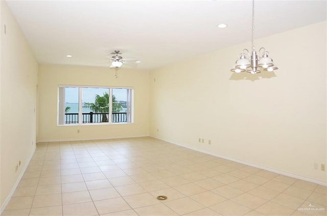 301 Houston St Unit 3303, Port Isabel, TX 78597 - empty room with a chandelier, a ceiling fan, recessed lighting, and light tile patterned flooring