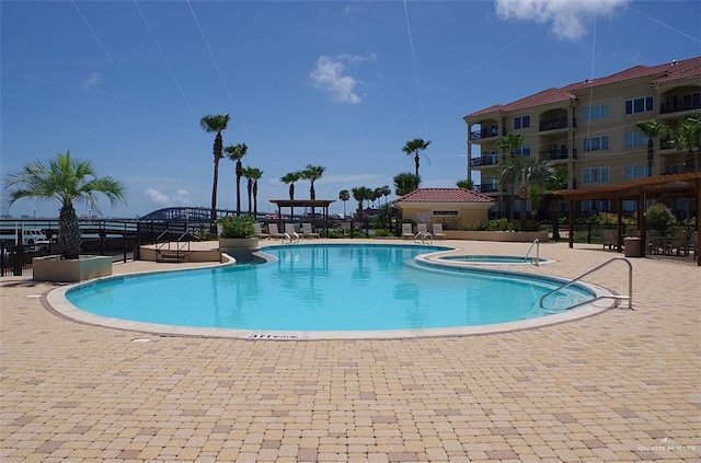 301 Houston St Unit 3303, Port Isabel, TX 78597 - community pool featuring a community hot tub and a patio area
