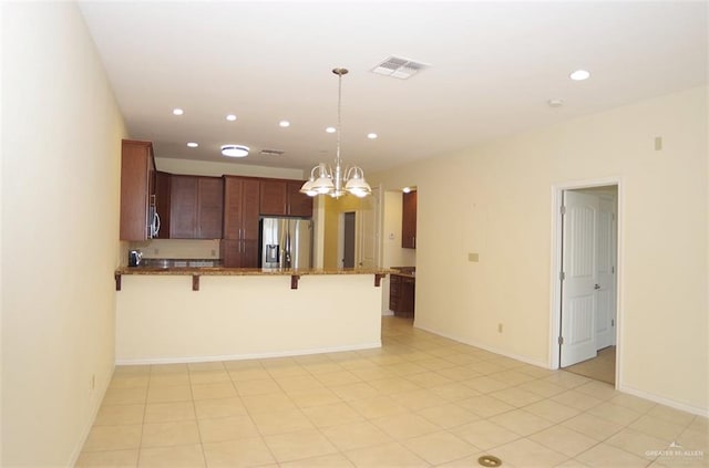 301 Houston St Unit 3303, Port Isabel, TX 78597 - kitchen featuring stainless steel appliances, a kitchen breakfast bar, a chandelier, a peninsula, and recessed lighting