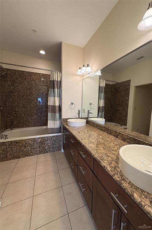 301 Houston St Unit 3303, Port Isabel, TX 78597 - bathroom with tile patterned floors, tiled shower / bath combo, double vanity, and recessed lighting
