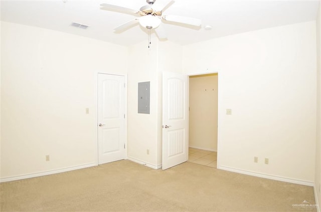 301 Houston St Unit 3303, Port Isabel, TX 78597 - unfurnished bedroom with electric panel, light carpet, and a ceiling fan