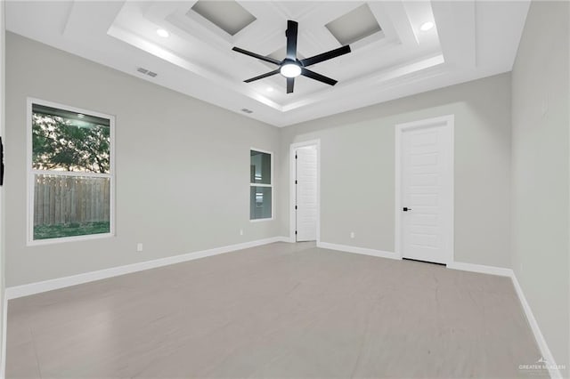 empty room with visible vents, baseboards, ceiling fan, a tray ceiling, and recessed lighting