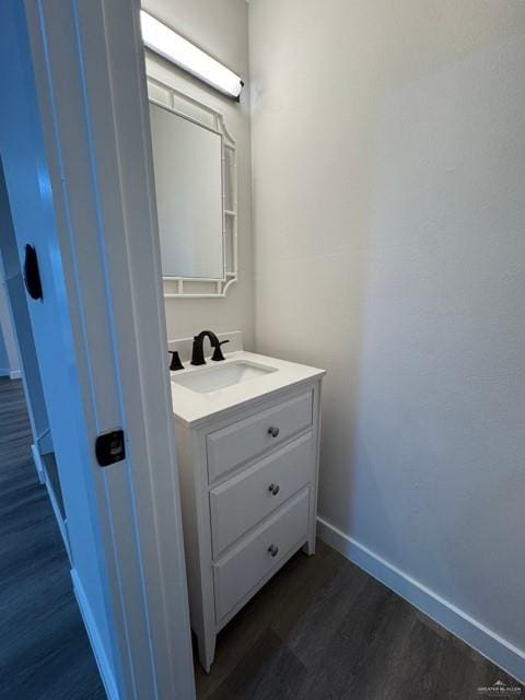 bathroom featuring vanity and hardwood / wood-style floors